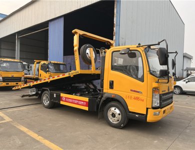 SINOTRUK HOWO 4×2 90 km/h Euro-II 110 HP Manual 6-Speed 2 t/3 t Axles 4 t Payload 5100×2300 mm Slide Flatbed 3-Ton One-Tow-Two Road Wrecker Tow Truck for Sale